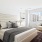 a bedroom with a large window