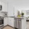 a kitchen with white cabinets