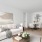 a living room with a white couch and a table